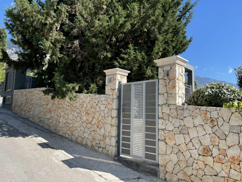 Stone Fence with Metal Gate