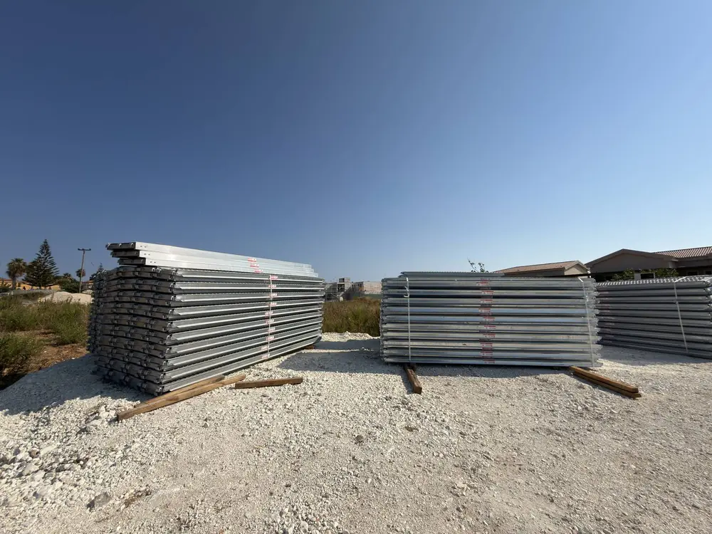 Stacks of galvanised scaffolding frames in the DNM Construction yard